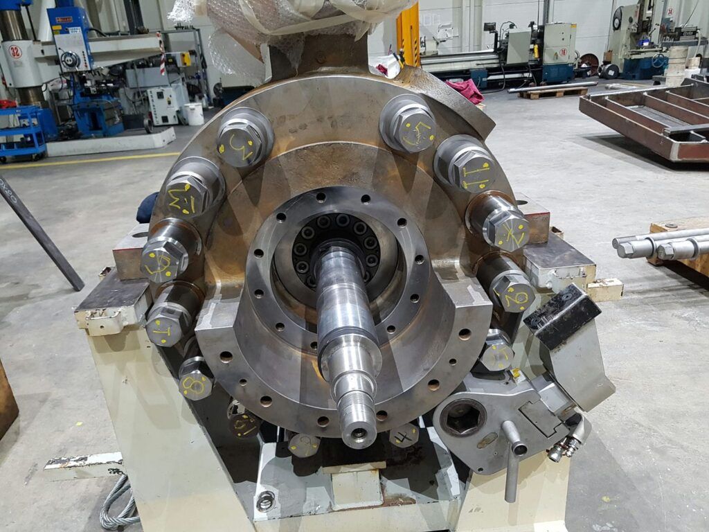 High pressure pump during assembly with new manufactured studs and cap-nuts